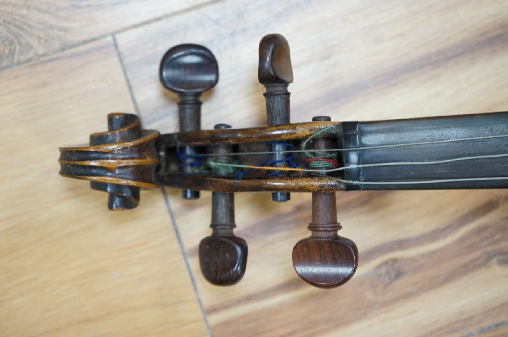 A cased 19th century French violin, back, 36cm. Condition - fair